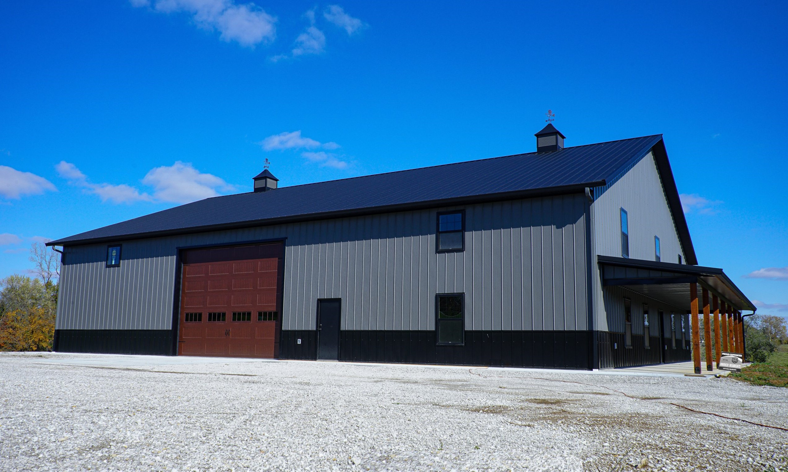 event center with grey siding and black roof